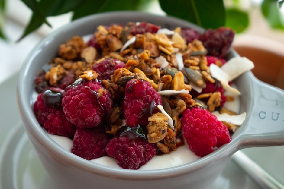 Delicious raspberry and granola yogurt bowl for a healthy breakfast.